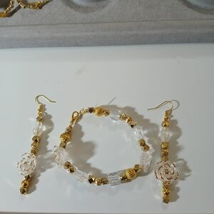 NWT Handcrafted Clear and Gold Trimmed Glass Flower Bracelet and Earrings Set.